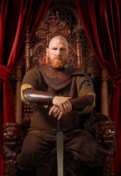 Historical Viking King on the throne in studio shoot