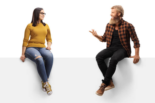 istock Bearded guy laughing and talking to a young female 1279314609