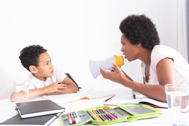 mother yells at the son because he won't learn mother yells at the son because he won't learn sad african child drawings stock pictures, royalty-free photos & images