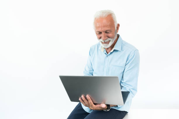 istock Smiling businessman working on laptop 1279314740