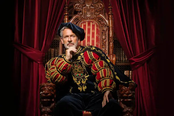 Photo of Historical King on the throne in studio shoot