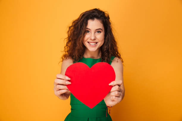 istock Cute young lady holding heart. 1279317837