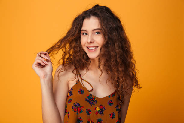 istock Cute young lady standing isolated over yellow background 1279318322