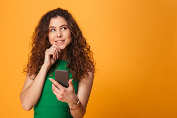 istock Cute young lady chatting by mobile phone. 1279318553