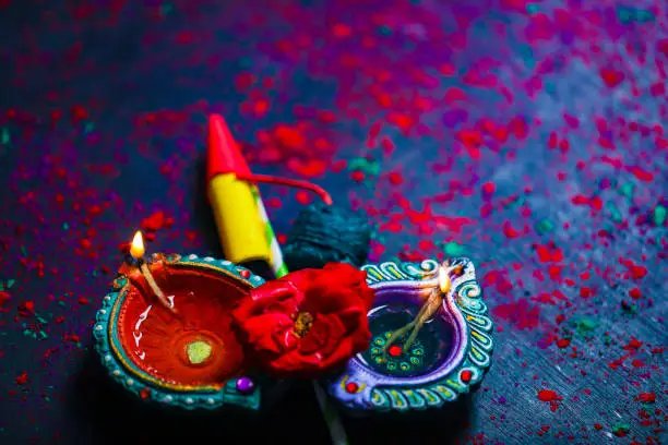 Photo of Concept of Indian festival Diwali, oil lamp or Diya with crackers