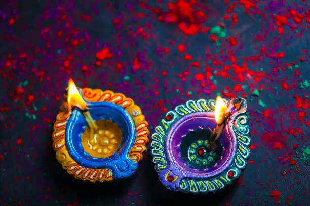 Photo of Concept of Indian festival Diwali, oil lamp or Diya with crackers