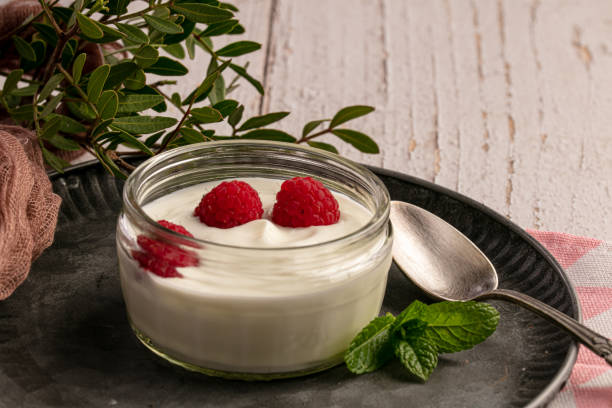 istock Yoghurt with raspberries on a metal plate 1279323358