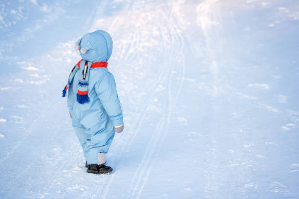 istock Little boy on snow background 1279325551