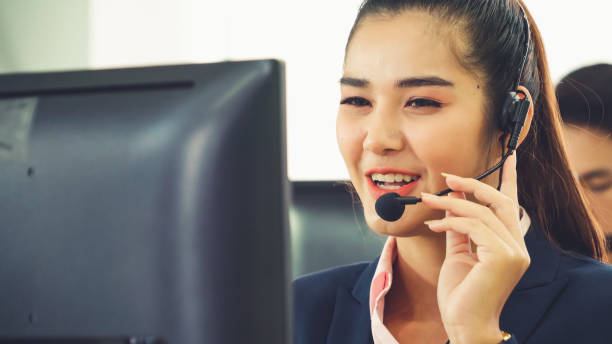 istock Business people wearing headset working in office 1279327897