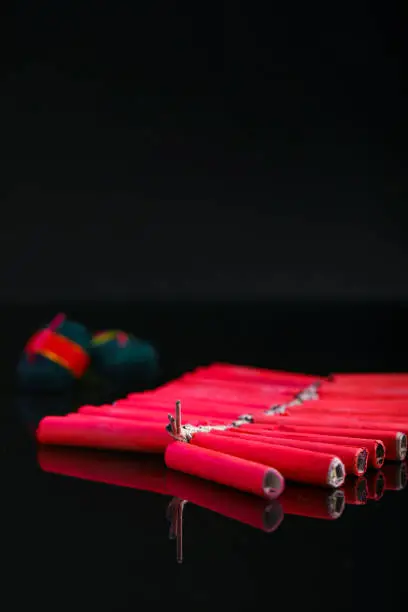 Photo of Celebrating Indian festival Diwali, crackers over dark background