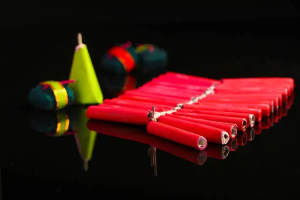 Photo of Celebrating Indian festival Diwali, crackers over dark background