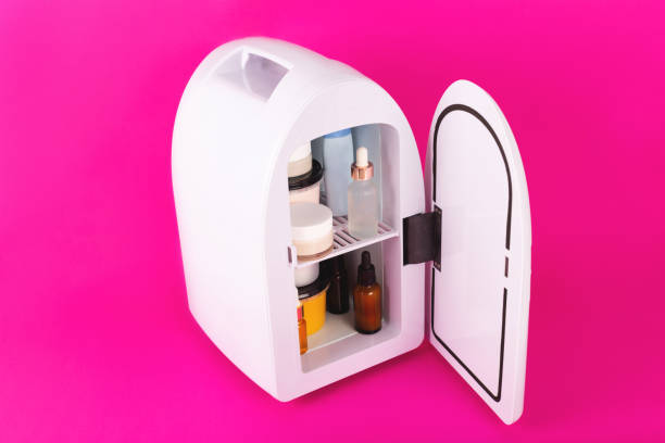 istock Mini fridge on vivid magenta background. Minimal composition. 1279329181