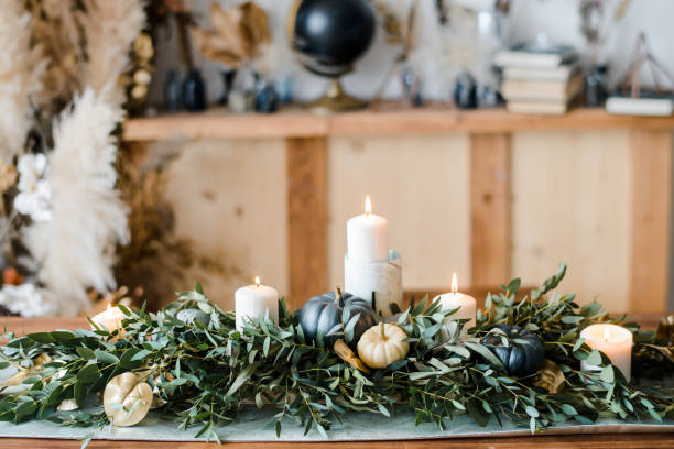 istock Halloween Table setting on dark background. Dish with sweets s on a dark table with black and gold pumpkin. Flat lay, top view trendy holiday concept. 1279333335