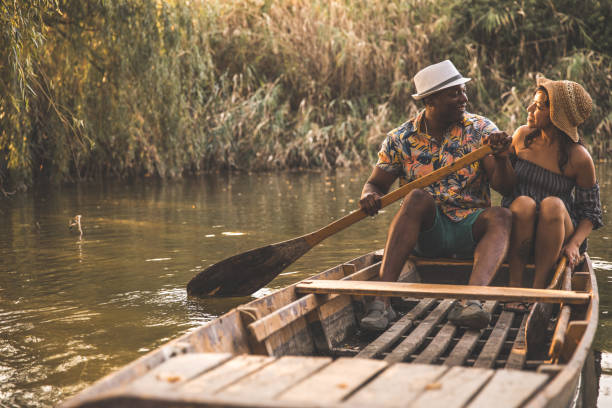 istock Couple looking at each other during a romantic adventure on the river 1279333887