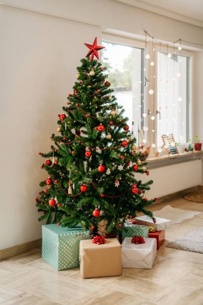 istock Christmas tree with presents in the living room 1279334997