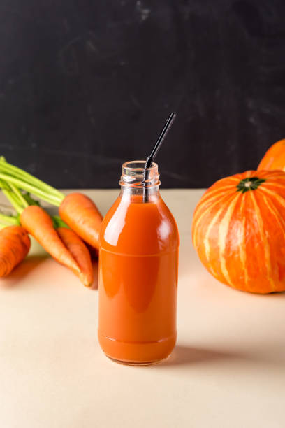 Bottle of Fresh Carrot and Pumpkin Juice Healthy Diet Beverage Horizontal Bottle of Fresh Carrot and Pumpkin Juice Healthy Diet Beverage Horizontal heathy stock pictures, royalty-free photos & images