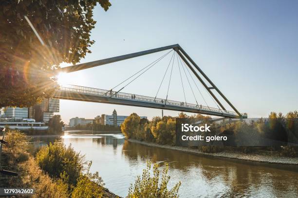 Silhouettes On Bridge Over Rhine River In Düsseldorf In Early Fall Season Stock Photo - Download Image Now