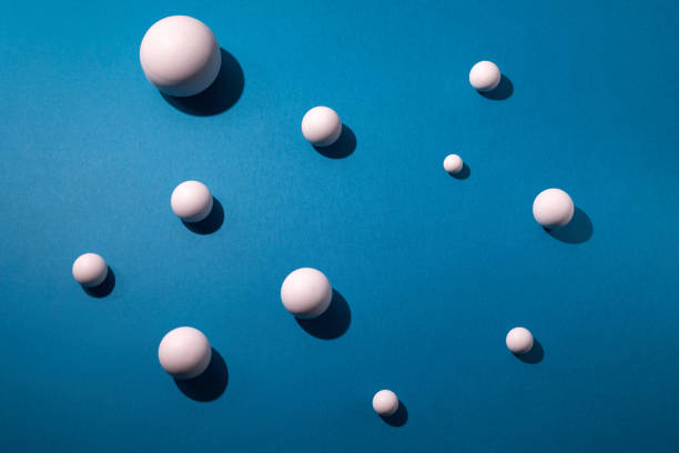 istock White balls on blue background. Flat lay, top view 1279342808