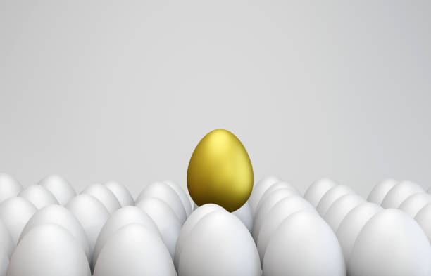 istock Standing out from the crowd. The golden egg among ordinary eggs. 1279343053