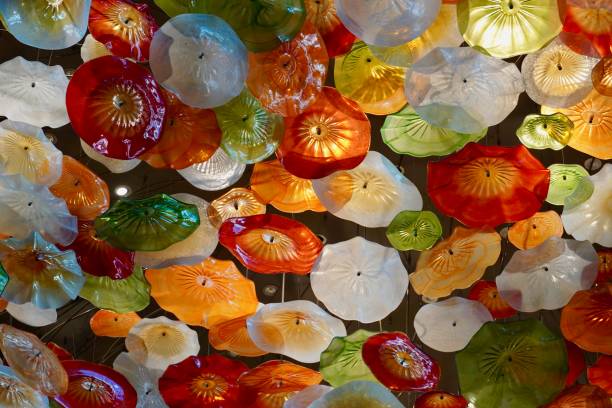istock Glade of artificial plastic interior colors. Yellow brown red white flowers for interior decoration 1279343131