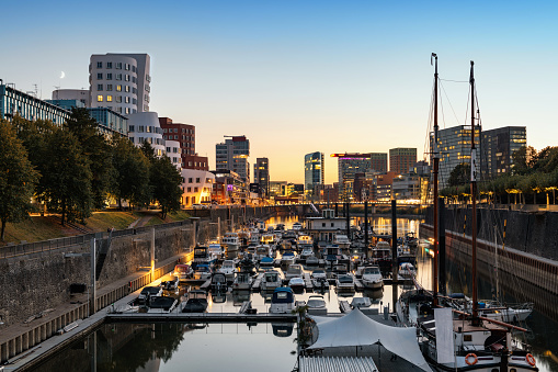view on media harbour with marina in Dusseldorf at blue hour