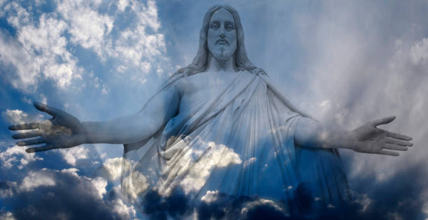 istock Jesus standing in white and gray storm clouds in blue sky with rays of light 1279348326