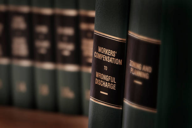 istock Workers compensation law books injured on the job and seeking help 1279348329