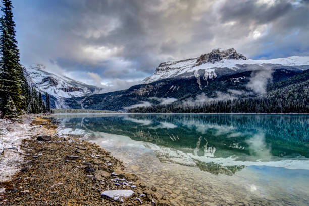 istock Reflections in Emerald Lake after a light snow fall 1279350887