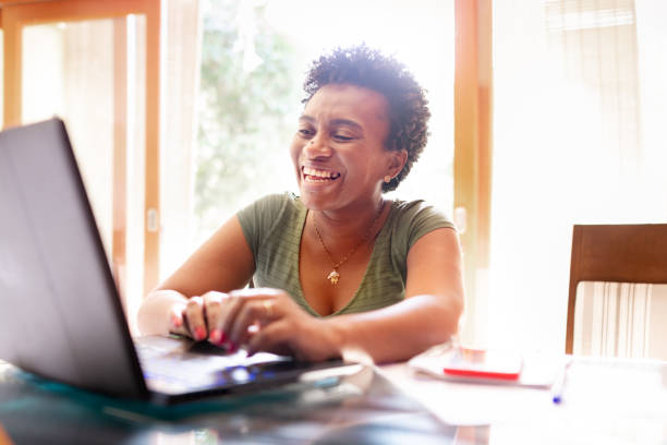 istock Modern woman using laptop and working at a home office 1279354303