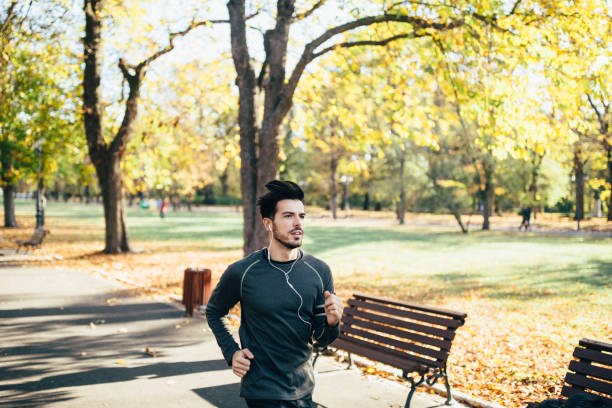 istock Man jogging in the autumn park 1279355066