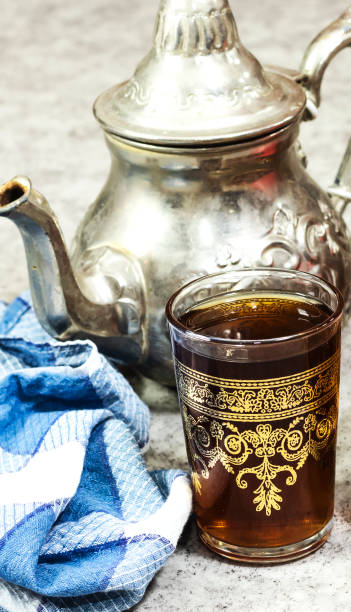 istock Traditional Moroccan Mint Tea with silver teapot, arabic drink 1279355264