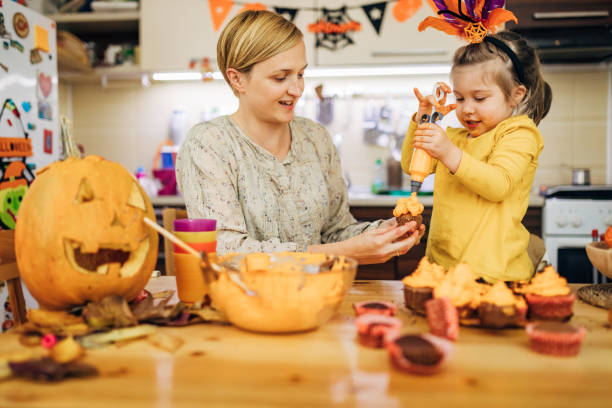 istock Halloween is fun time! We have so much fun while decorating cupcakes for trick and treat 1279362538