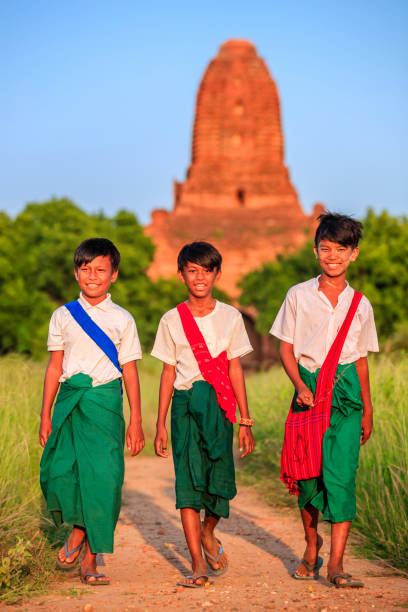 istock Young Burmese schoolboys walking in Bagan, Myanmar 1279362746
