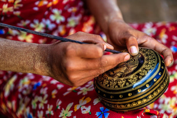 istock Young Burmese girl making a lacquerware in Bagan, Myanmar 1279363613