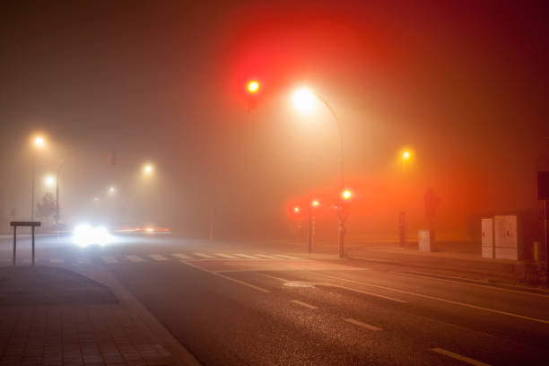 istock traffic lights in thick fog 1279365246