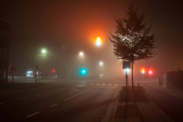 istock traffic lights in thick fog 1279365248