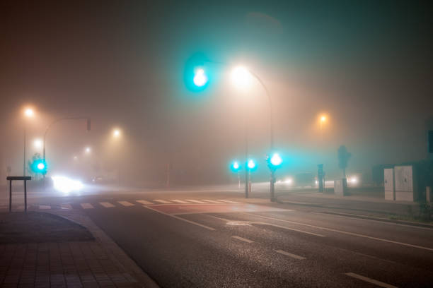 istock traffic lights in thick fog 1279365249