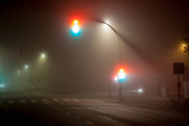 istock traffic lights in thick fog 1279365261