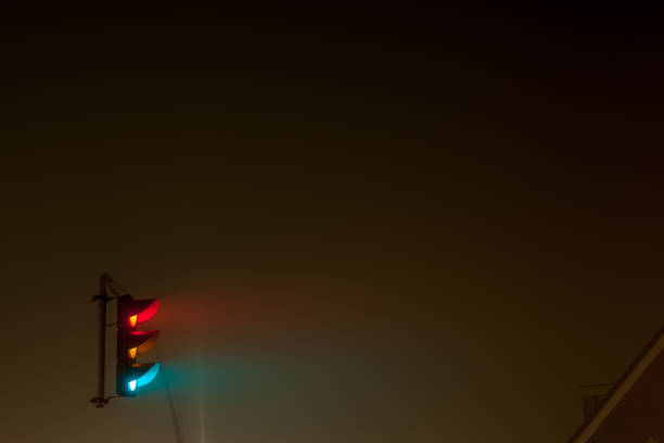 istock traffic lights in thick fog 1279365268