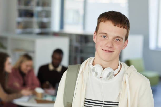 istock Portrait of Smiling Young Man in Library 1279365980