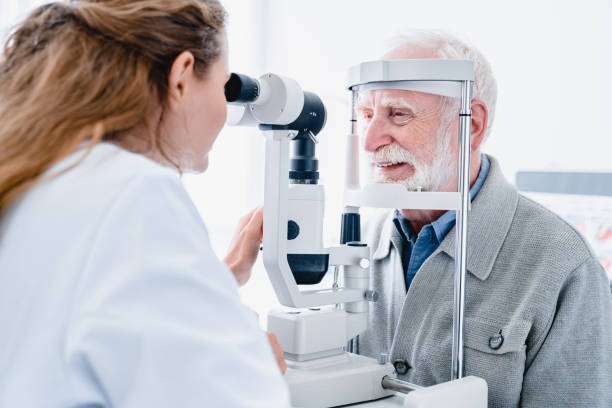 istock Happy male patient undergoing vision check performed by female ophthalmologist 1279370275
