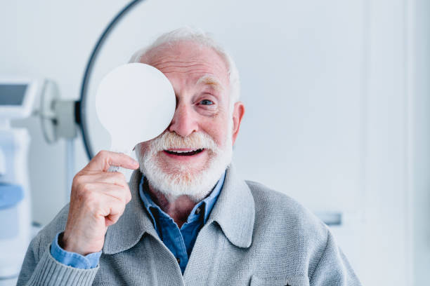 istock Happy aged grandfather checking up vision closing his eye 1279370291