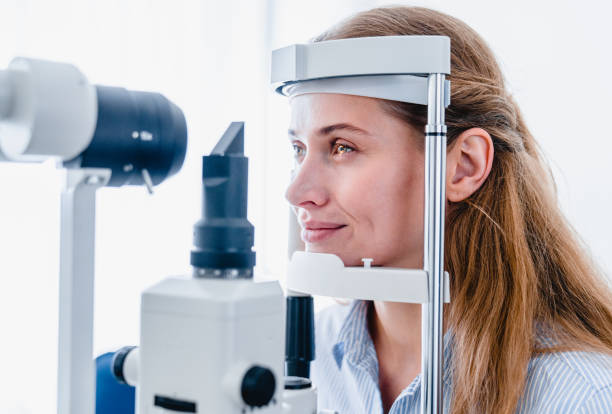 istock Young woman patient undergoing ophthalmic vision check up : side view 1279370432