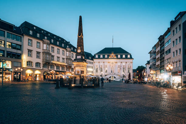 market square in Bonn / Germany market square in Bonn / Germany with the old town hall in background. Many restaurants are located around this place. Some tourist walking around. bonn photos stock pictures, royalty-free photos & images