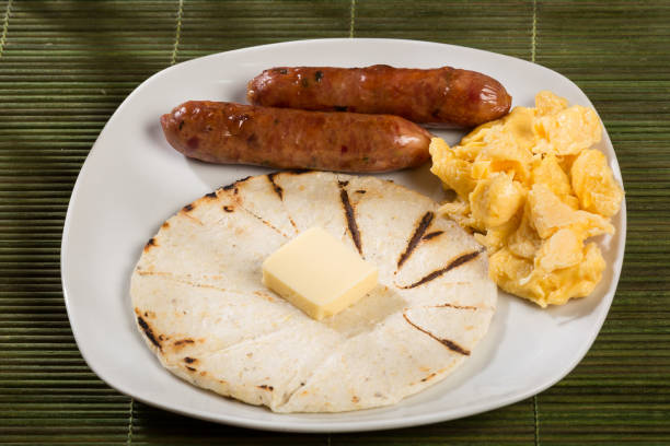 istock Tasty Colombian breakfast; White corn arepa with chorizo and scrambled eggs. 1279371946