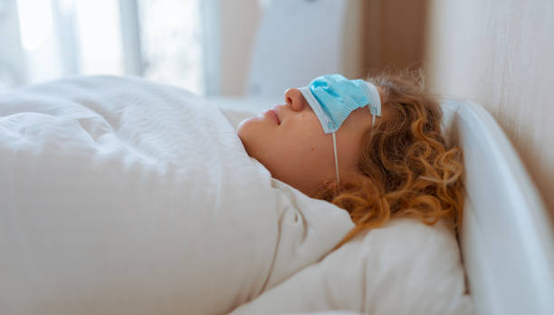 istock Woman sleep with surgical mask on her eyes 1279373724