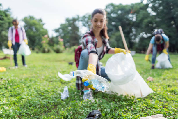 istock Group of people doing community cleanup work 1279375710