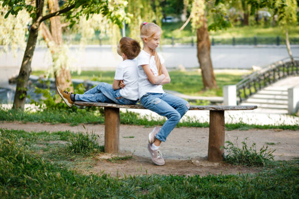 istock Children resent each other on a bench. 1279375979