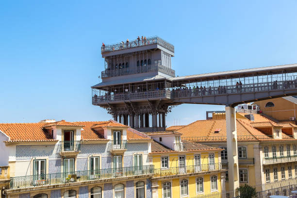Santa Justa lift in Lisbon Santa Justa lift built by Raoul Mesnard in 1902 in Lisbon in a beautiful summer day, Portugal santa justa lift portugal stock pictures, royalty-free photos & images