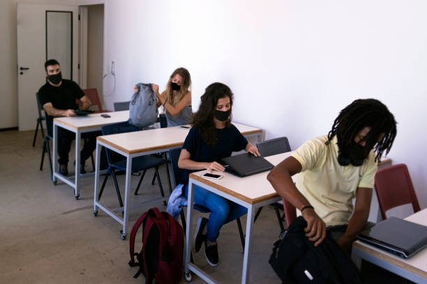 istock Group of university students at the classroom. Wearing face mask. 1279377012